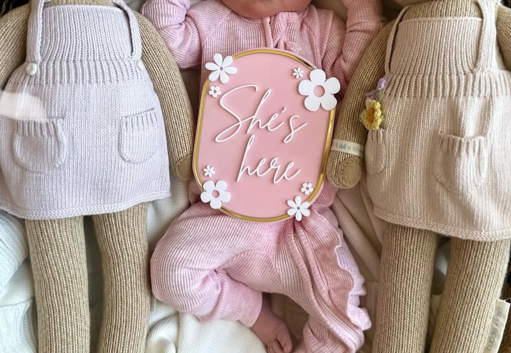 She’s here plaque